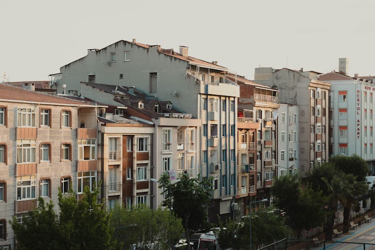 Charming streetscape of Istanbul showcasing classic apartment buildings at dusk.