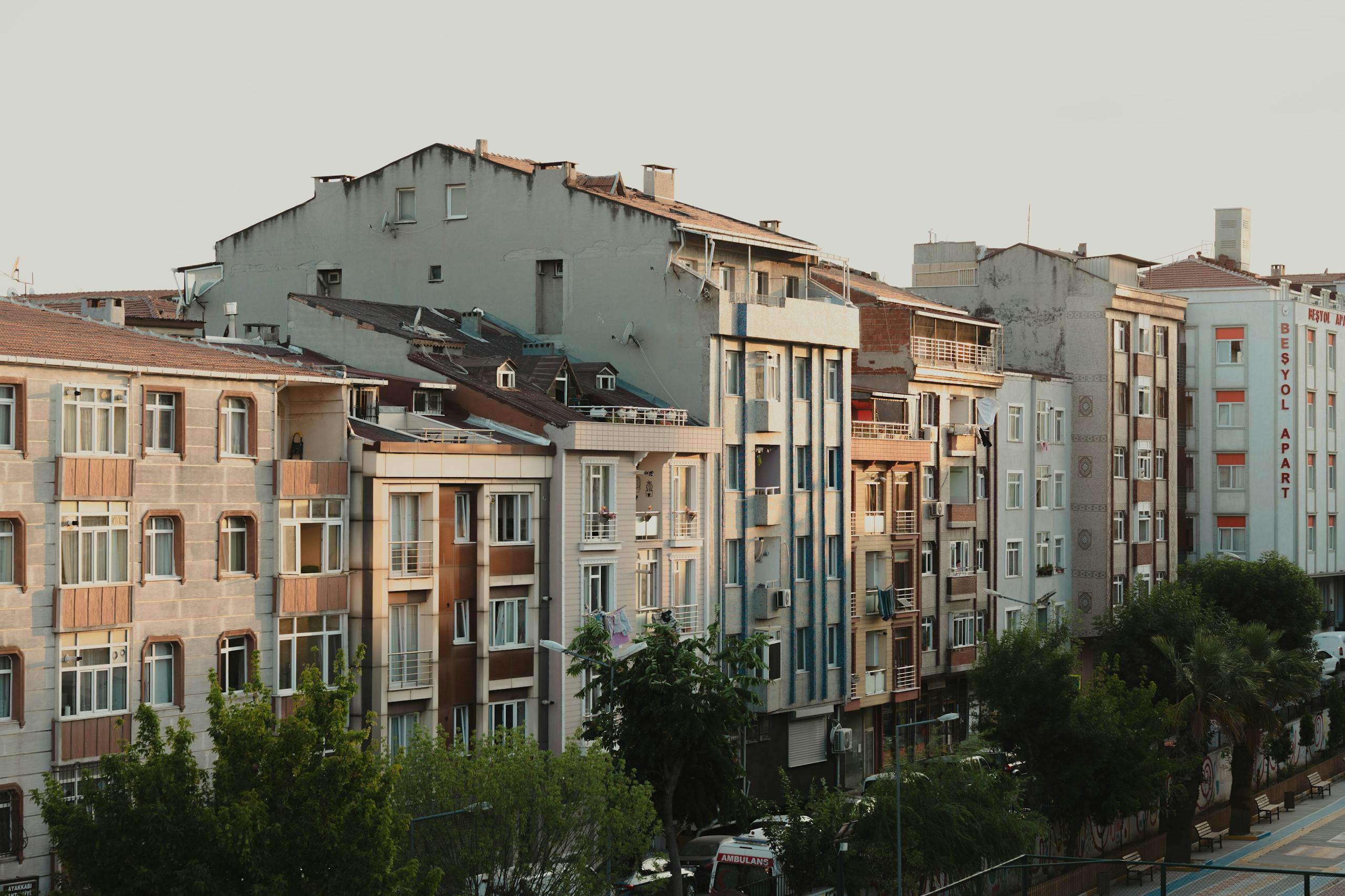 Charming streetscape of Istanbul showcasing classic apartment buildings at dusk.